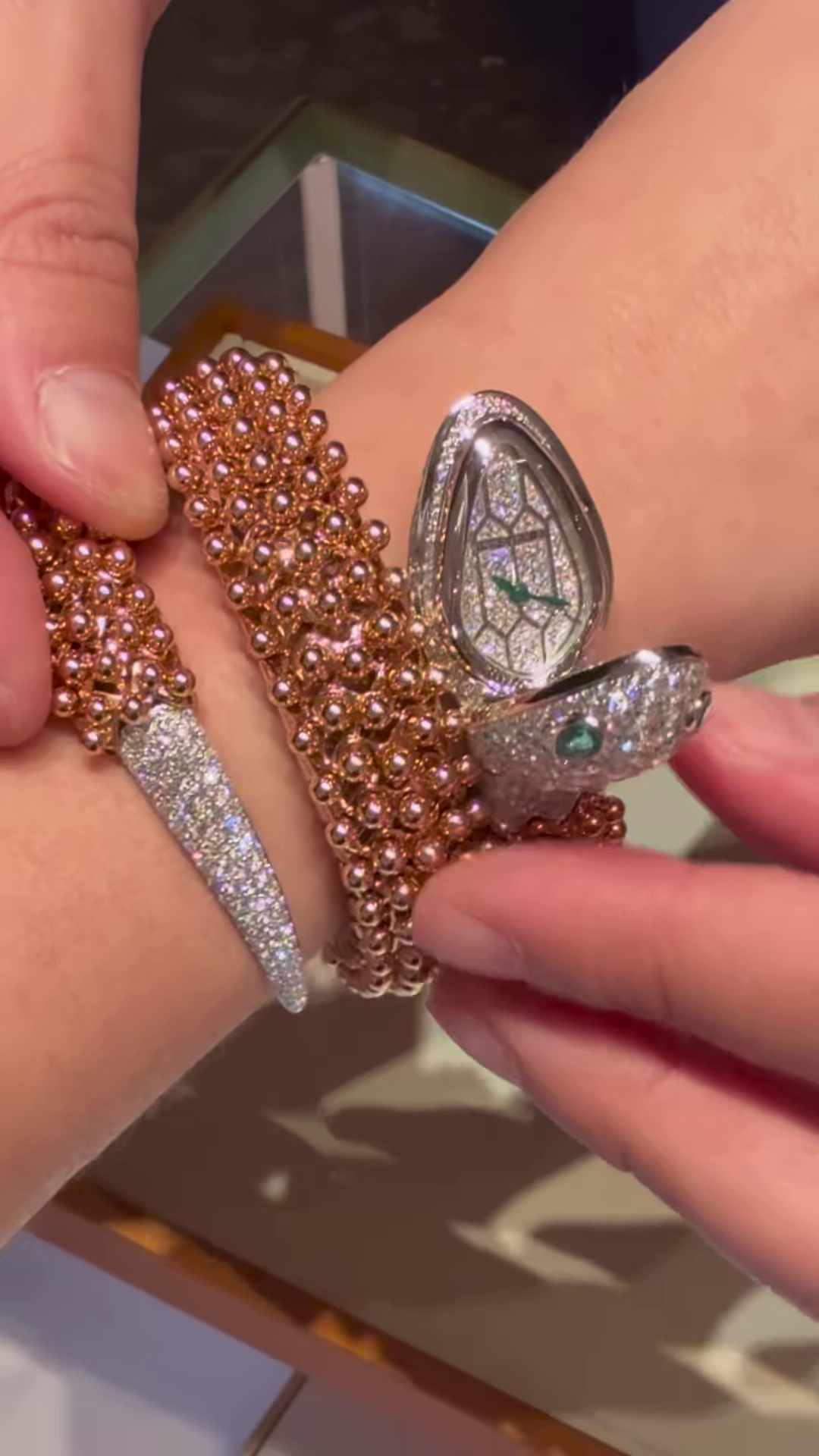 Exotic Rose Gold-Toned Coiled Snake Bracelet with Dazzling Clear Gemstones and Emerald-Inspired Eyes