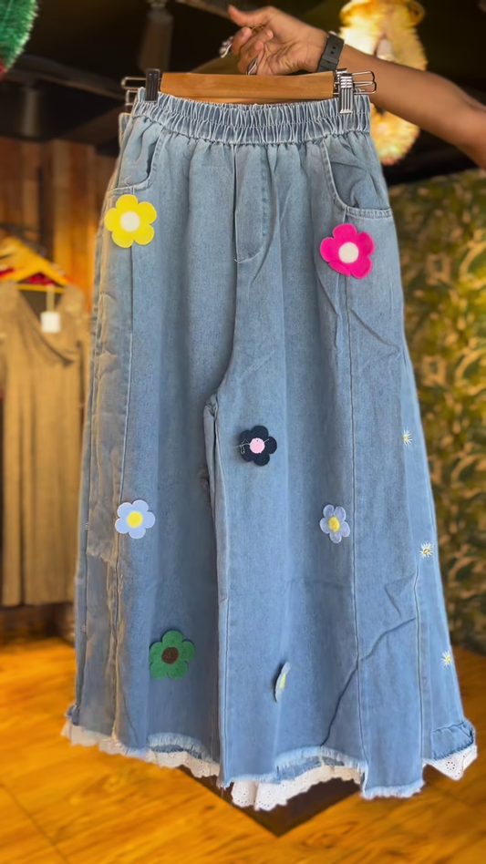 Playful Denim Wide-Leg Trousers with Colorful Flower Appliques & Lace Trim – Women’s Unique Bottoms