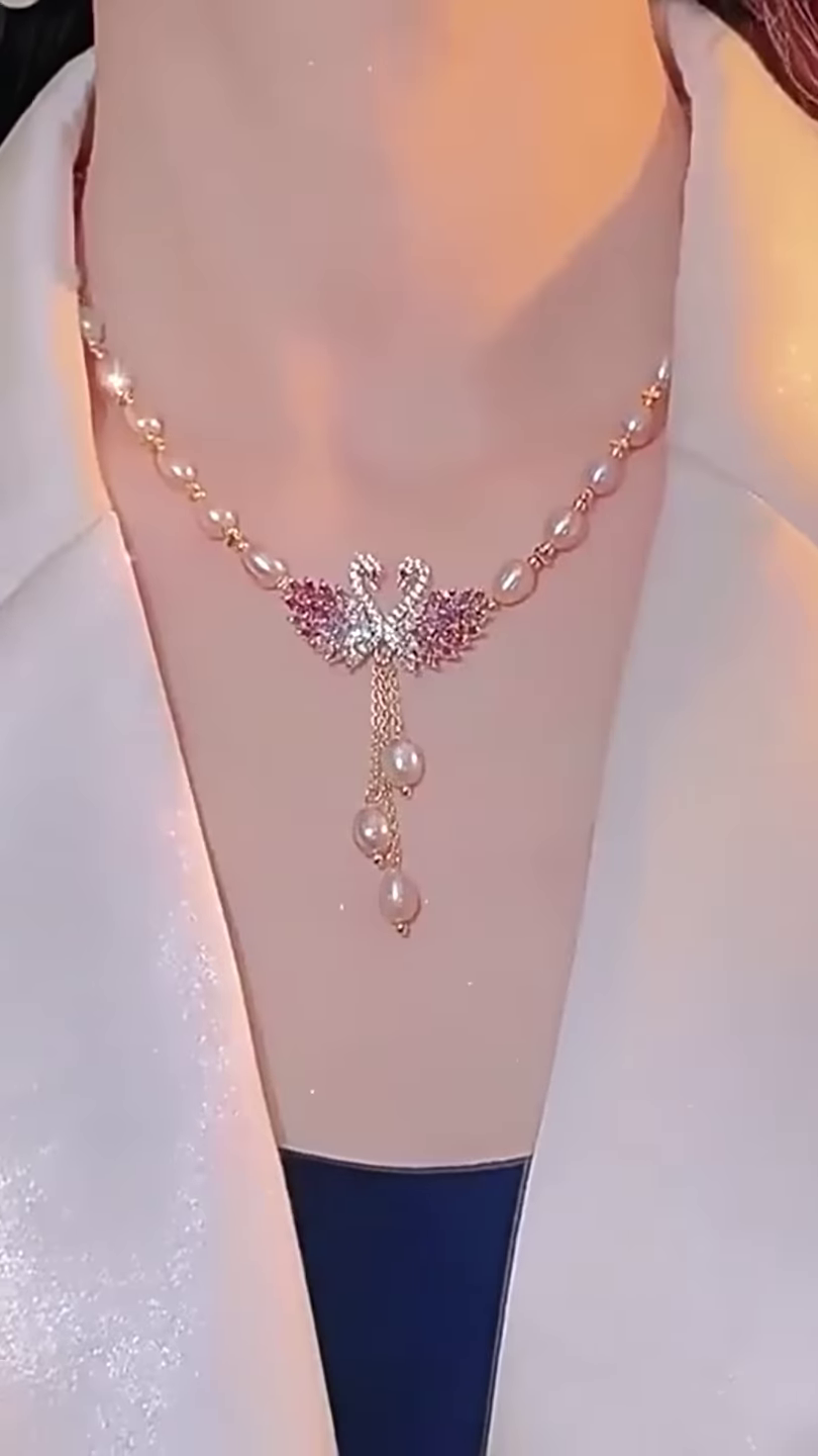 Elegant Pearl Necklace with Sparkling Swan Pendant and Gemstone Accents
